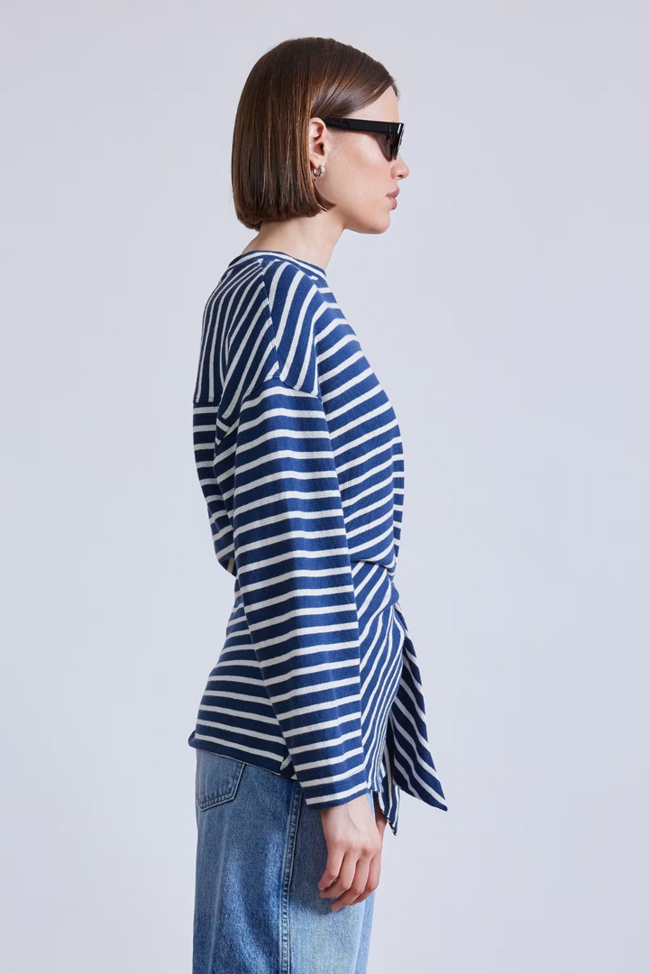 Model wearing Apiece Apart Long Sleeve Vanina Top side view