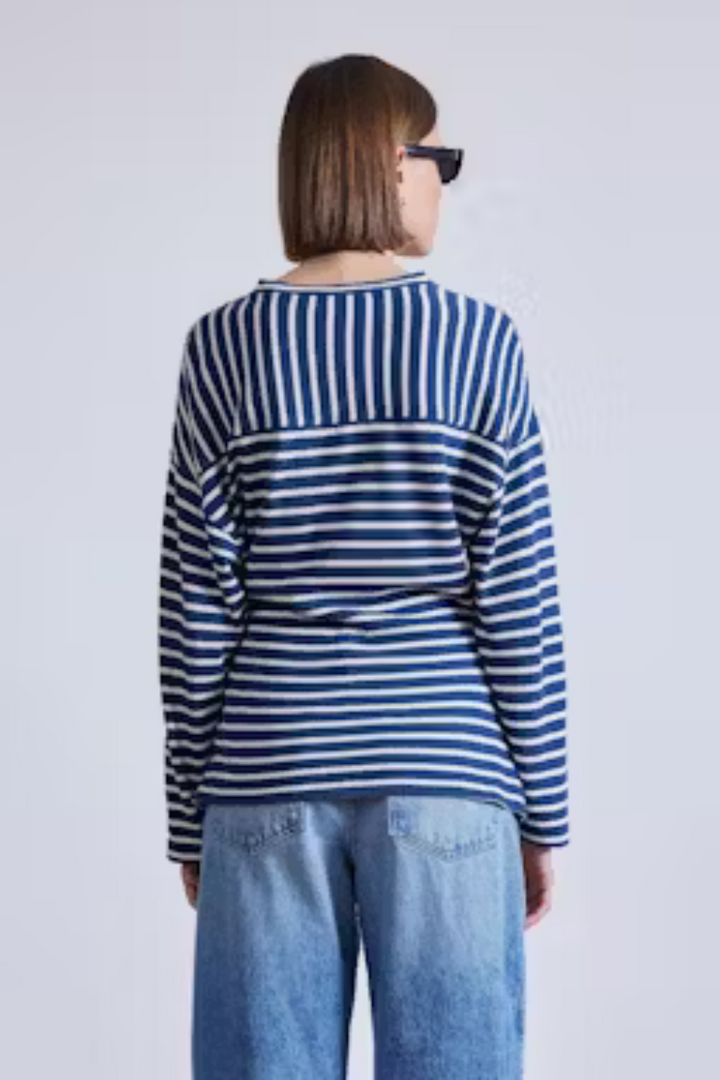 Model wearing Apiece Apart Long Sleeve Vanina Top rear view