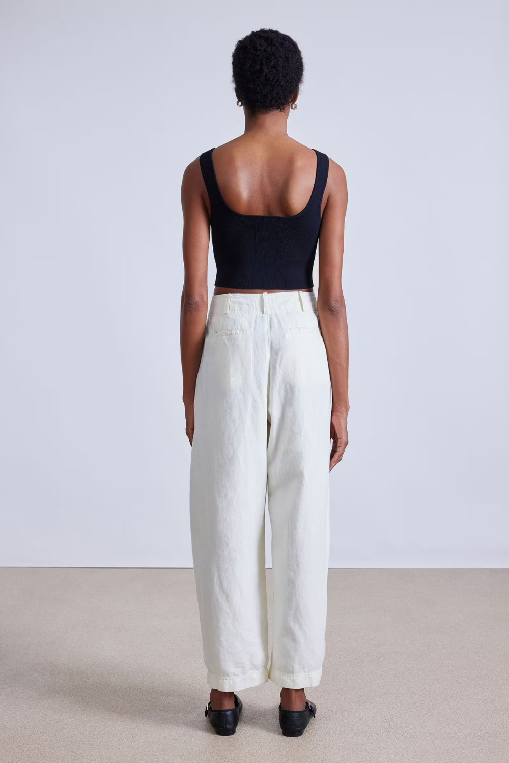 Model wearing Apiece Apart Bari Crop Trouser rear view