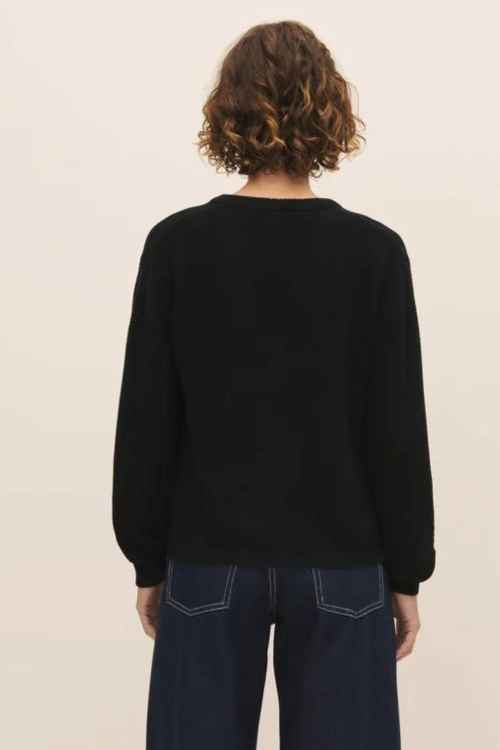 Model wearing Kowtow Escape Crew rear view