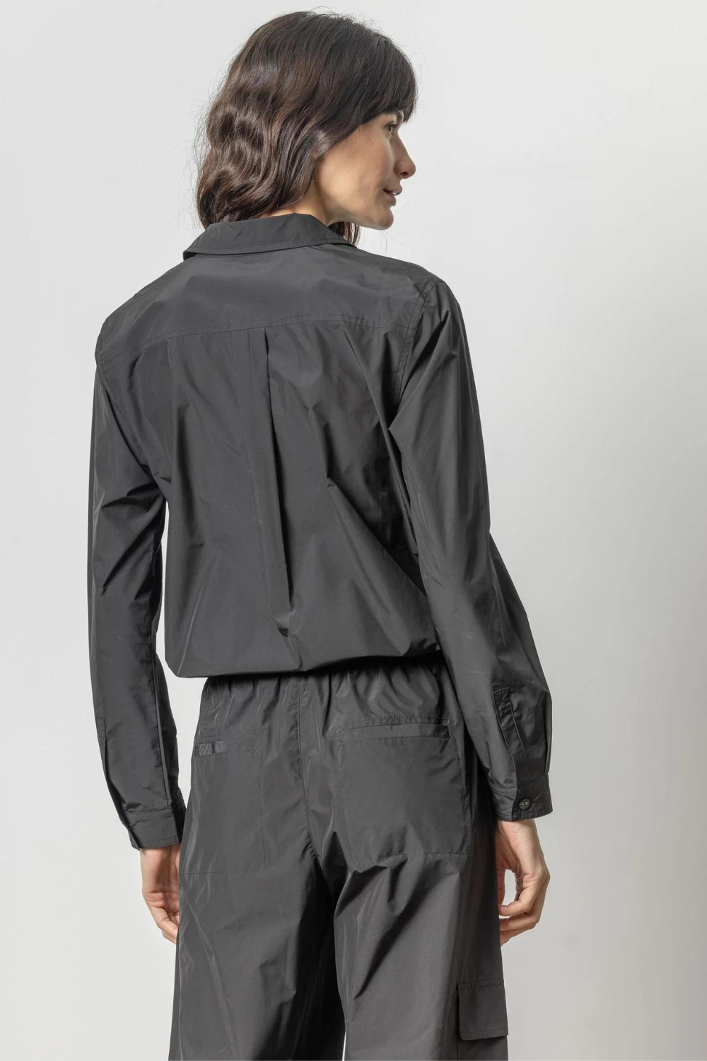 Model wearing Lilla P Nylon Drawstring Button Down rear view