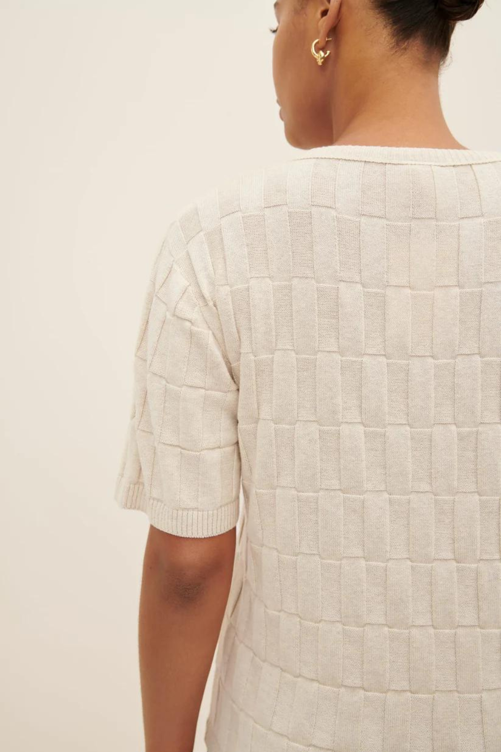 Model wearing Kowtow Etch Tee Light rear view