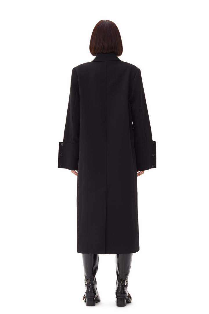 Model wearing Ganni Bonded Crepe Coat rear view