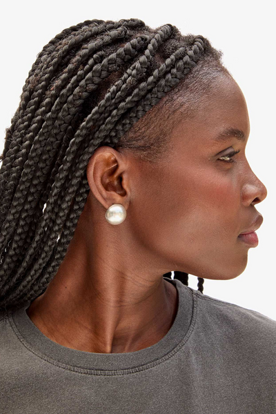 Model wearing Clare V. Dome Studs