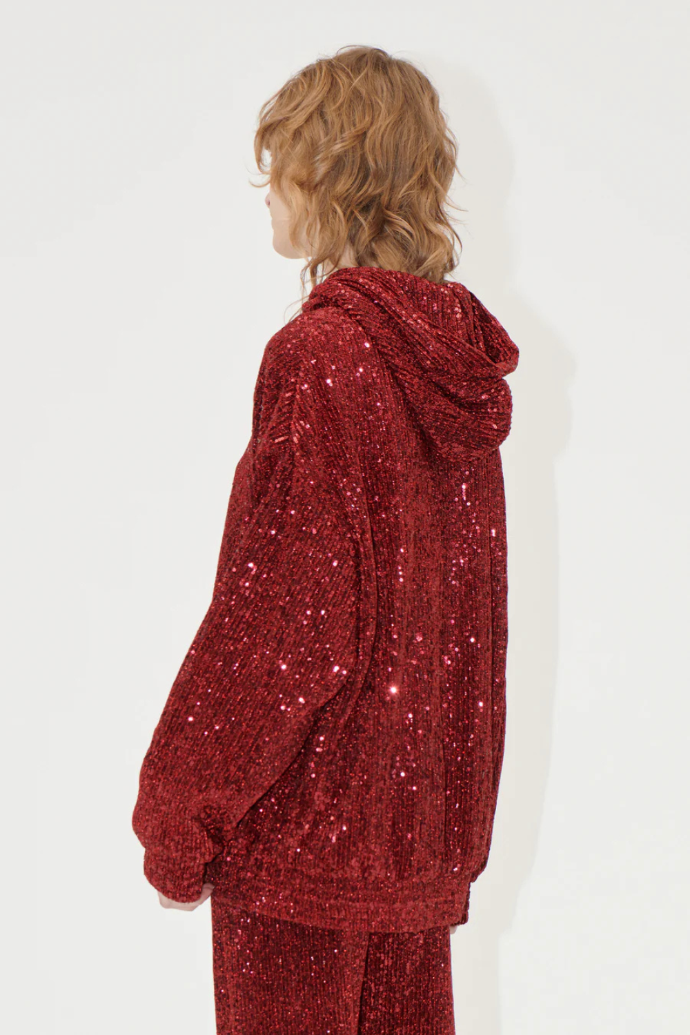 Model wearing Stine Goya Sequins Jersey Oversize Hoodie rear view