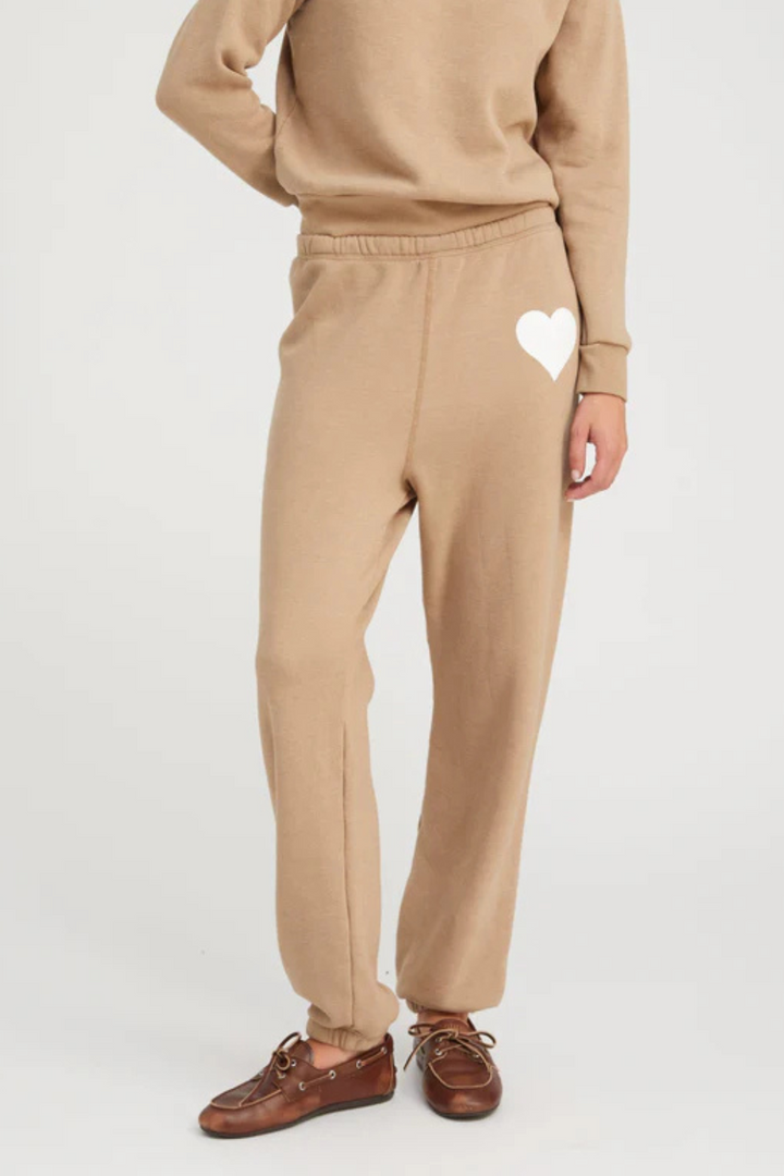 Model wearing SPRWMN Heart Sweatpant Latte White front view