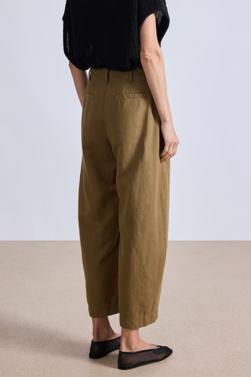 Model wearing Apiece Apart Bari Crop Trouser Toffee rear view