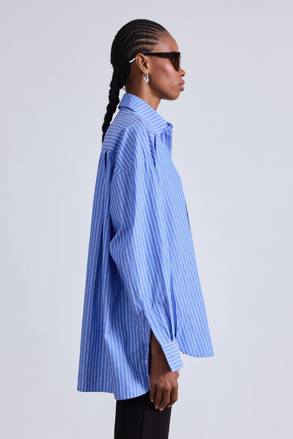 Model wearing Apiece Apart Aldea Oversized Button Down side view