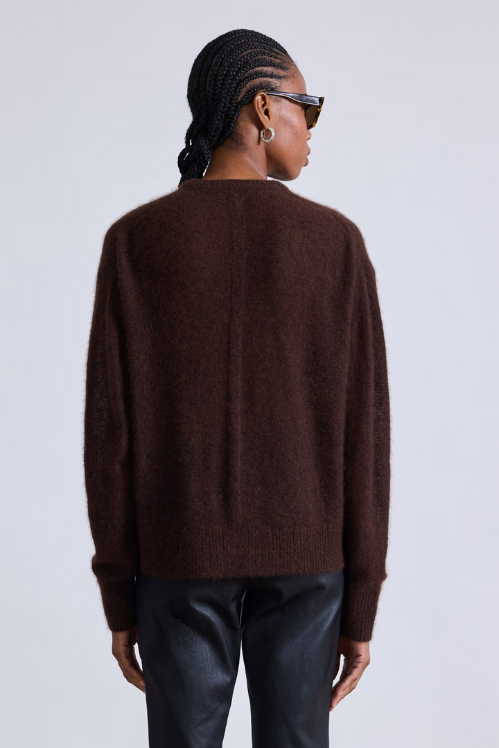 Model wearing Apiece Apart Softest Tissue Weight Sweater rear view