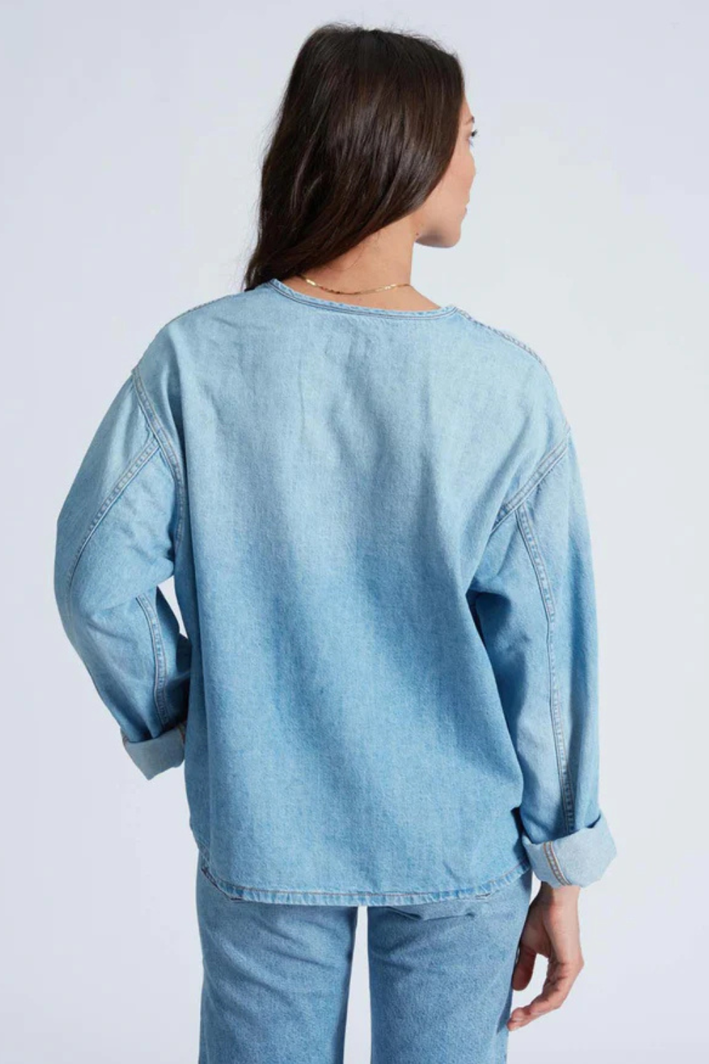 Model wearing ASKK NY Denim Henley rear view