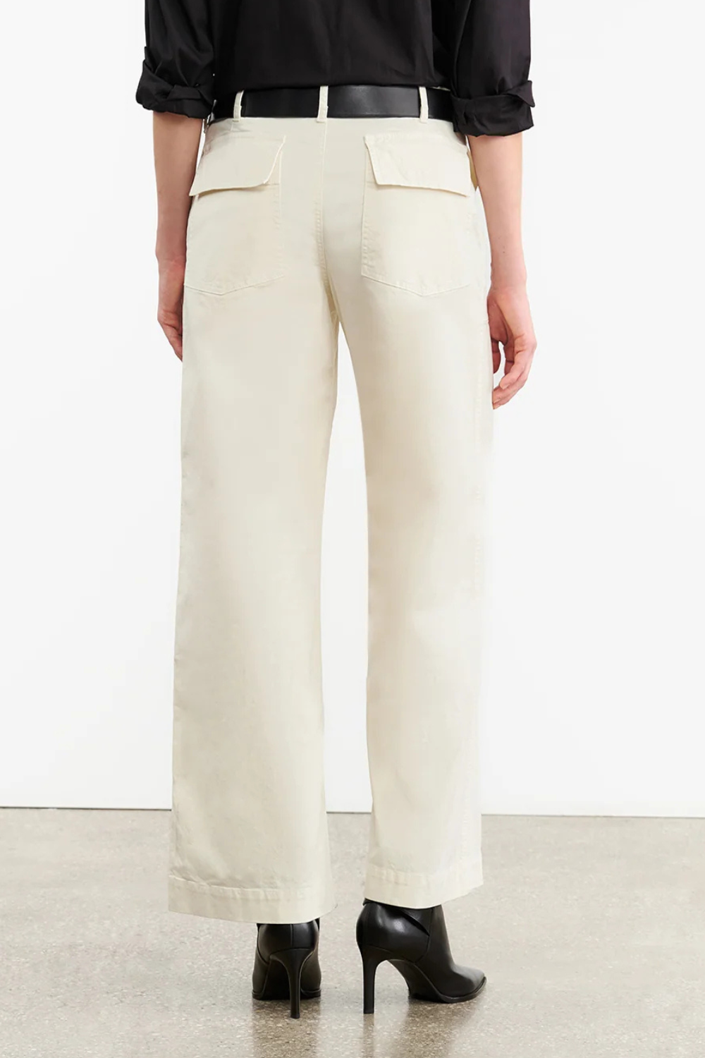 Model wearing Nili Lotan Leon Boy Pant rear view