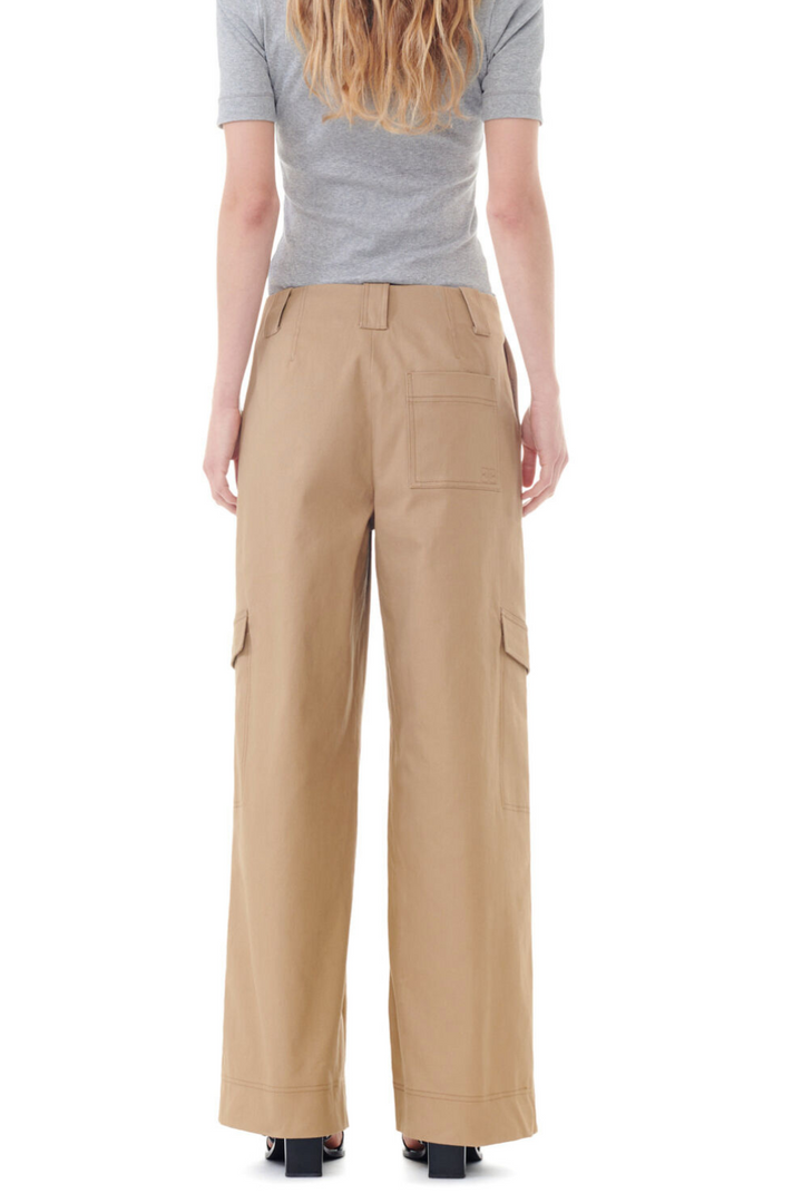 Model wearing Ganni Herringbone Canvas Mid Waist Cargo Pants rear view