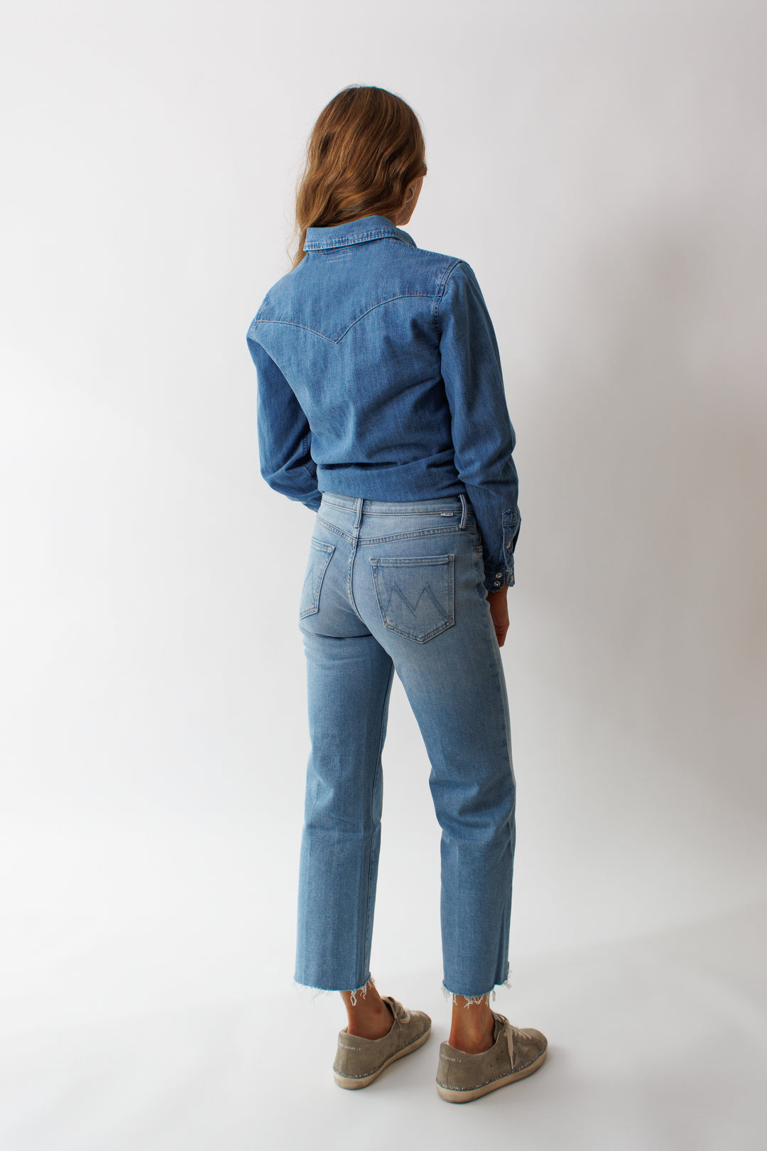 Mari wearing Mother Denim The Kick It Ankle Fray rear view