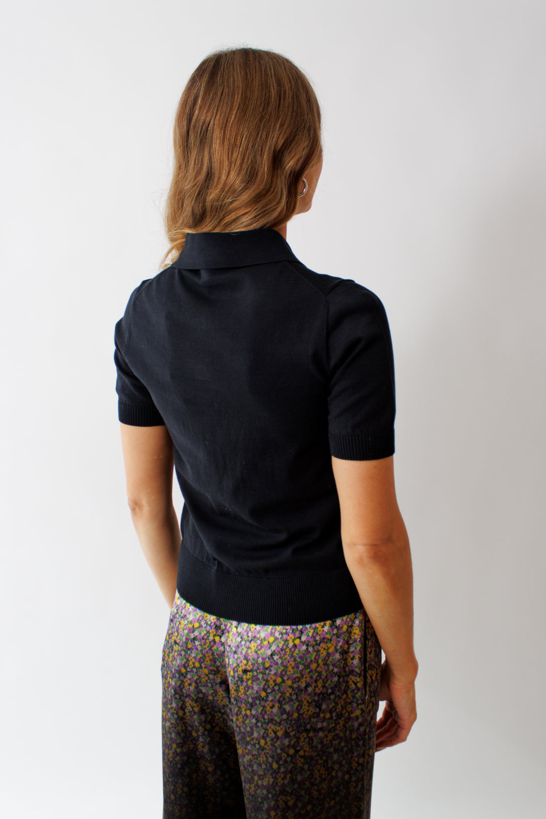 Mari wearing N°21 Bejeweled Snap Closure Cotton Polo rear view