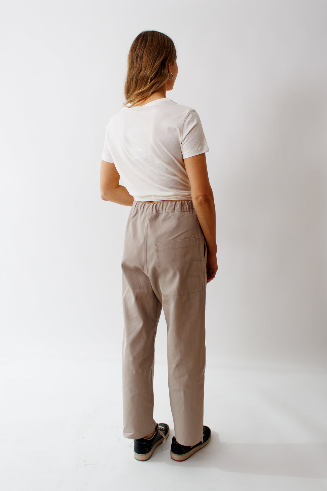 Mari wearing Plock Relaxed Woven Low Crotch Pant Stone rear view