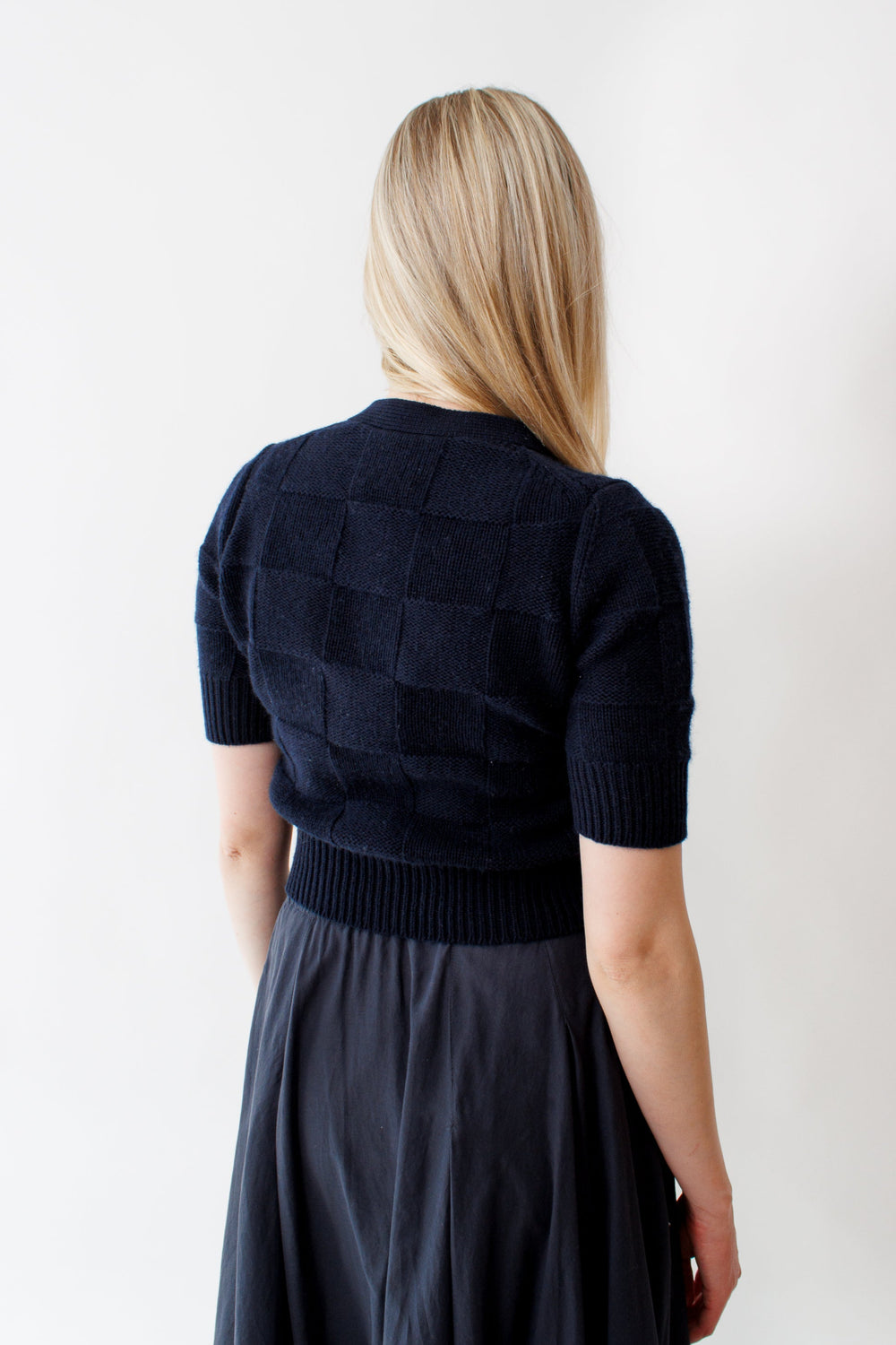 Bailey wearing Allude Cotton Cashmere Woven Check V Cardigan rear view 