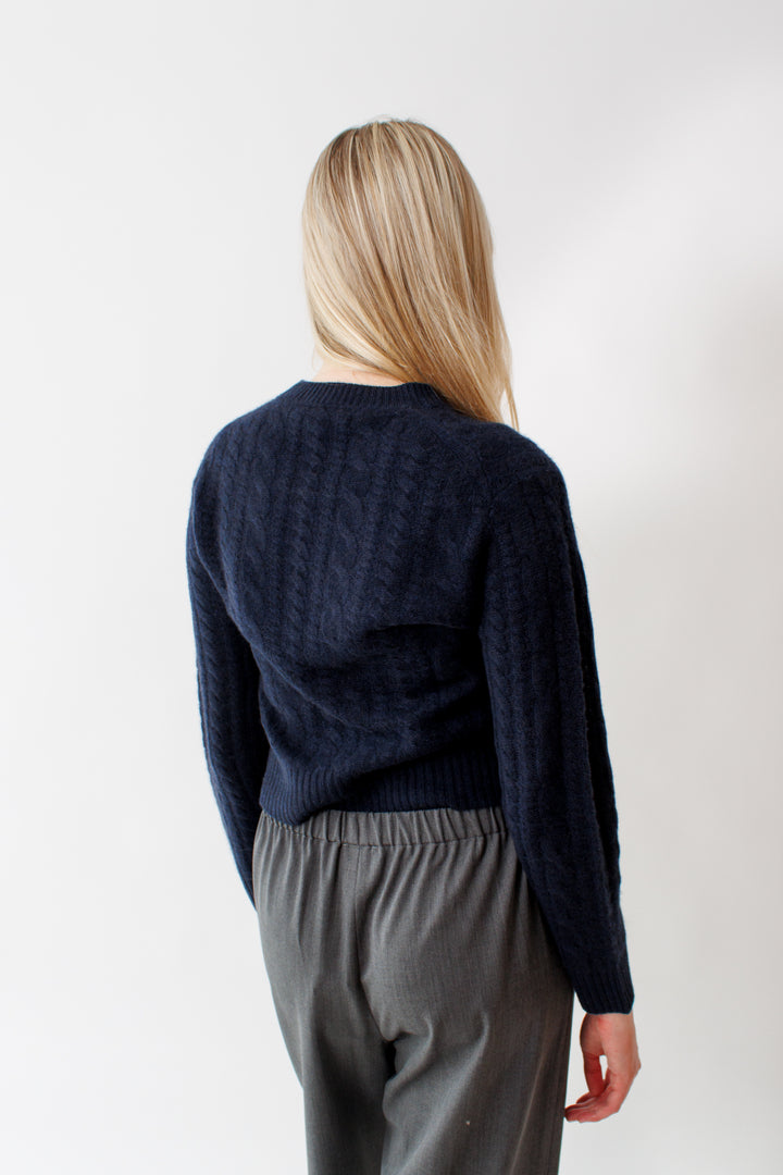 Bailey wearing White + Warren Cashmere Cropped Cable Crew rear view