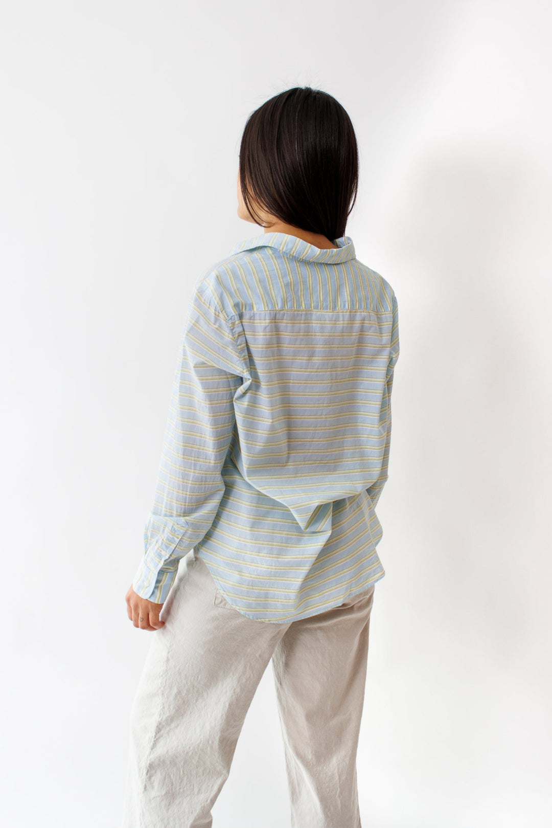 Amanda wearing Eileen Woven Button Up Blue Chartreuse Multi Stripe rear view