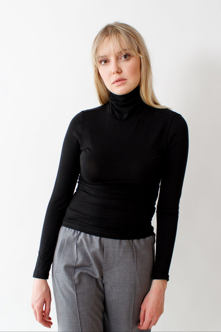 Bailey wearing Pima Cotton Spandex Turtleneck Top Black front view