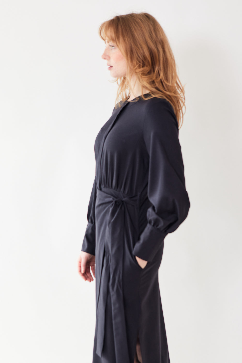 Waverly wearing Odeeh Virgin Wool Long Button Down Wrap Dress front/side view