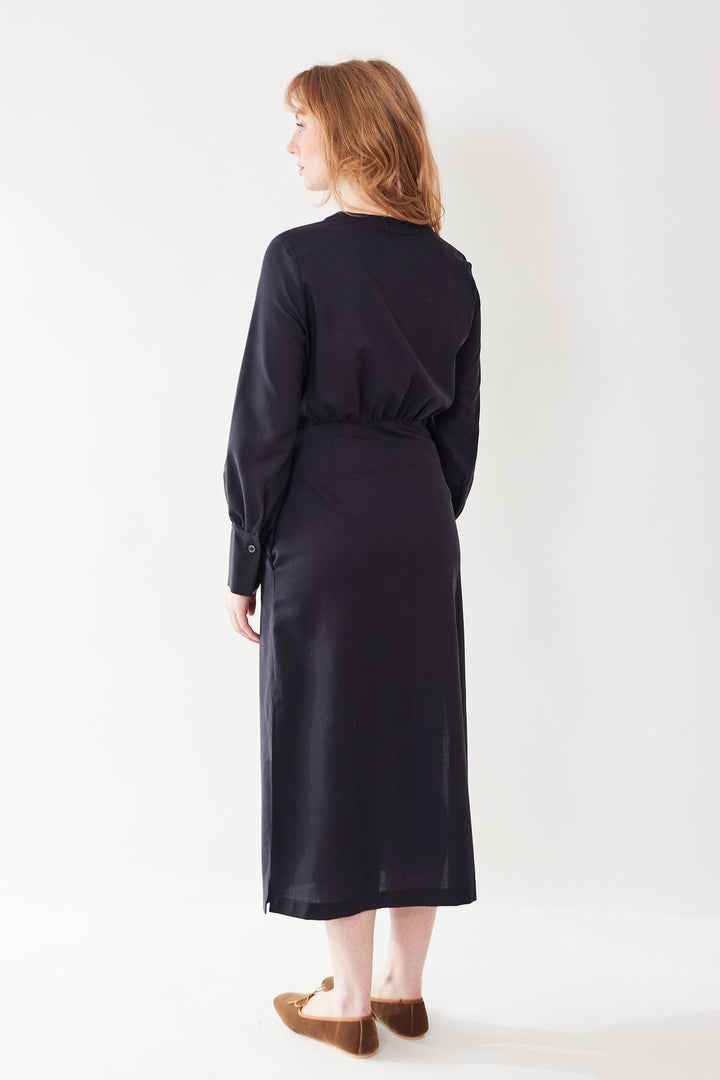 Waverly wearing Odeeh Virgin Wool Long Button Down Wrap Dress rear view