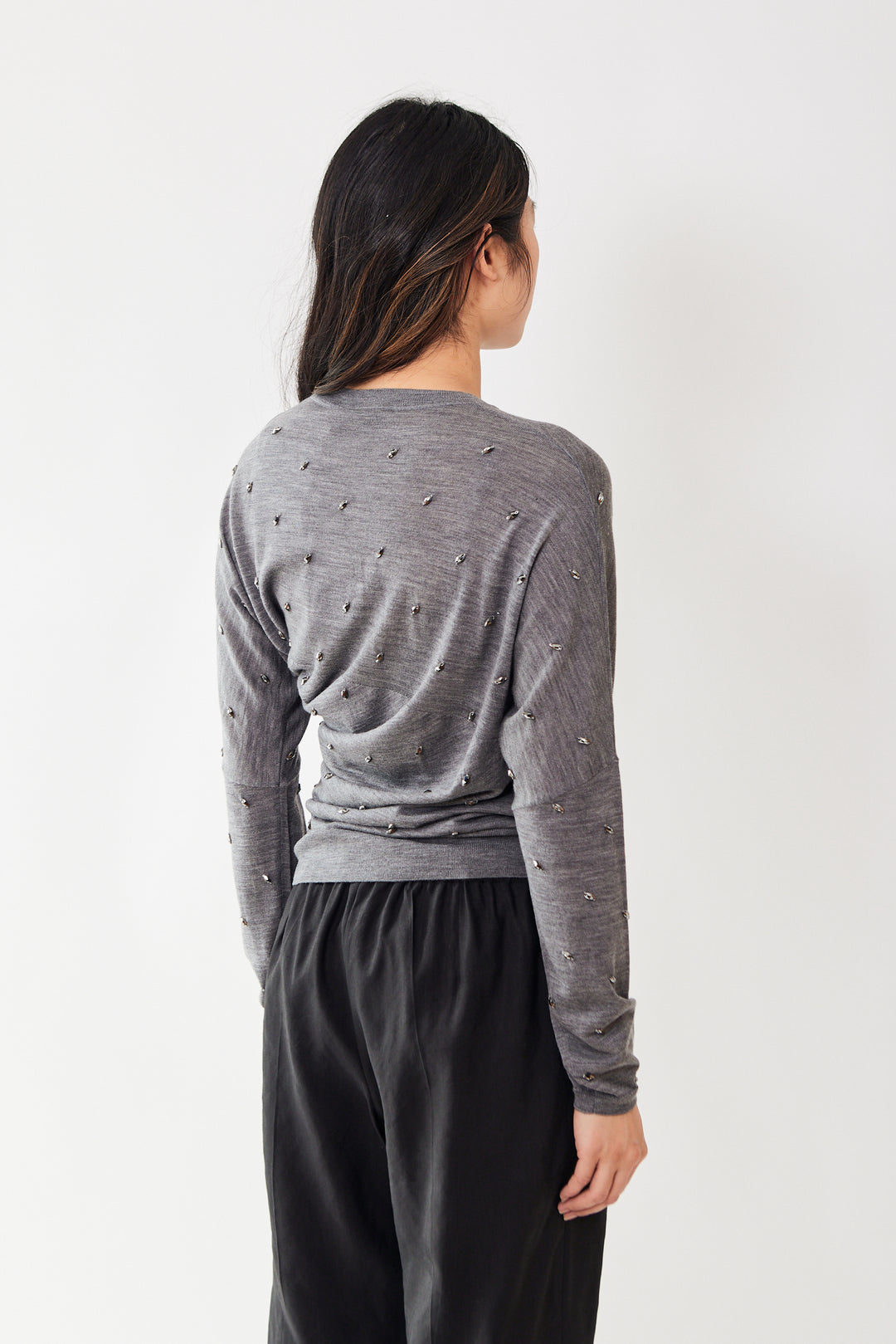 Madelyn wearing Odeeh Twist And Flash Sweater rear view