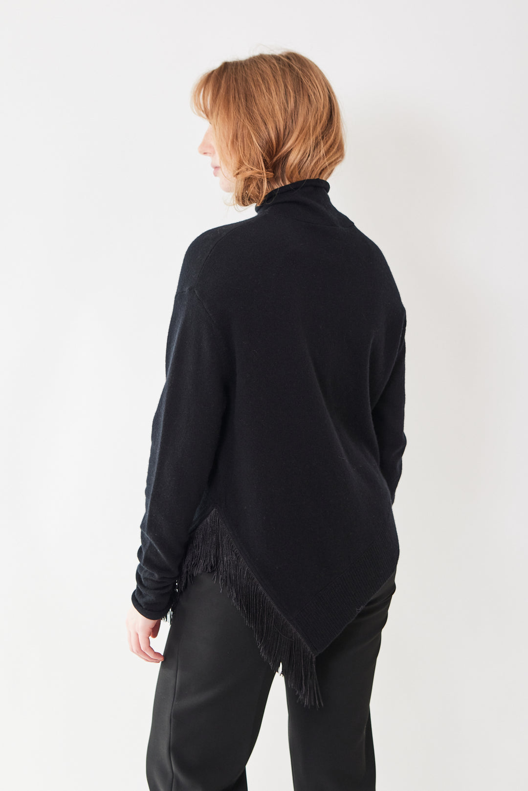 Waverly wearing Dorothee Schumacher Fringe Statement Pullover rear view