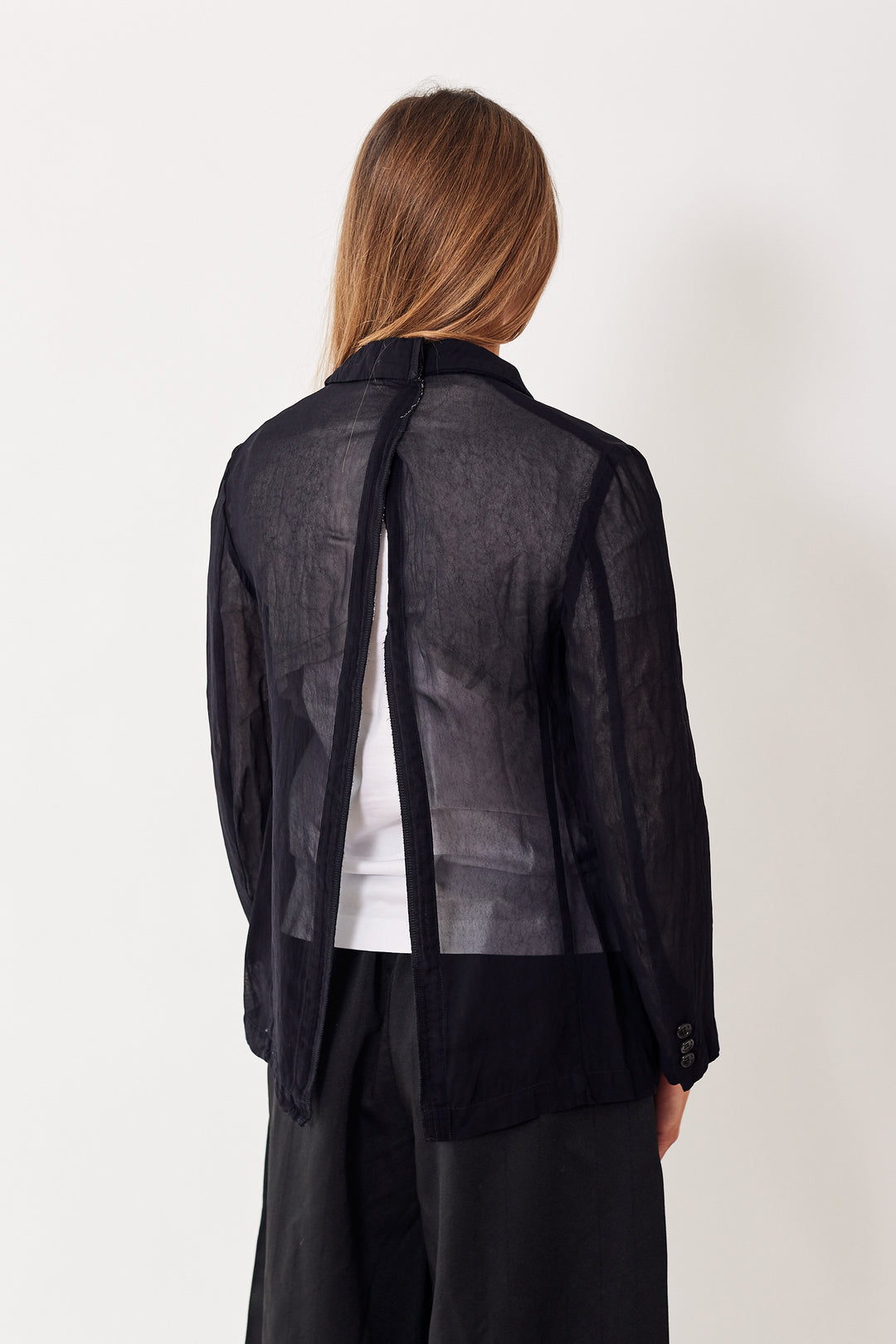 Mari wearing Comme des Garçons Sheer Open Back No Steam Jacket rear view