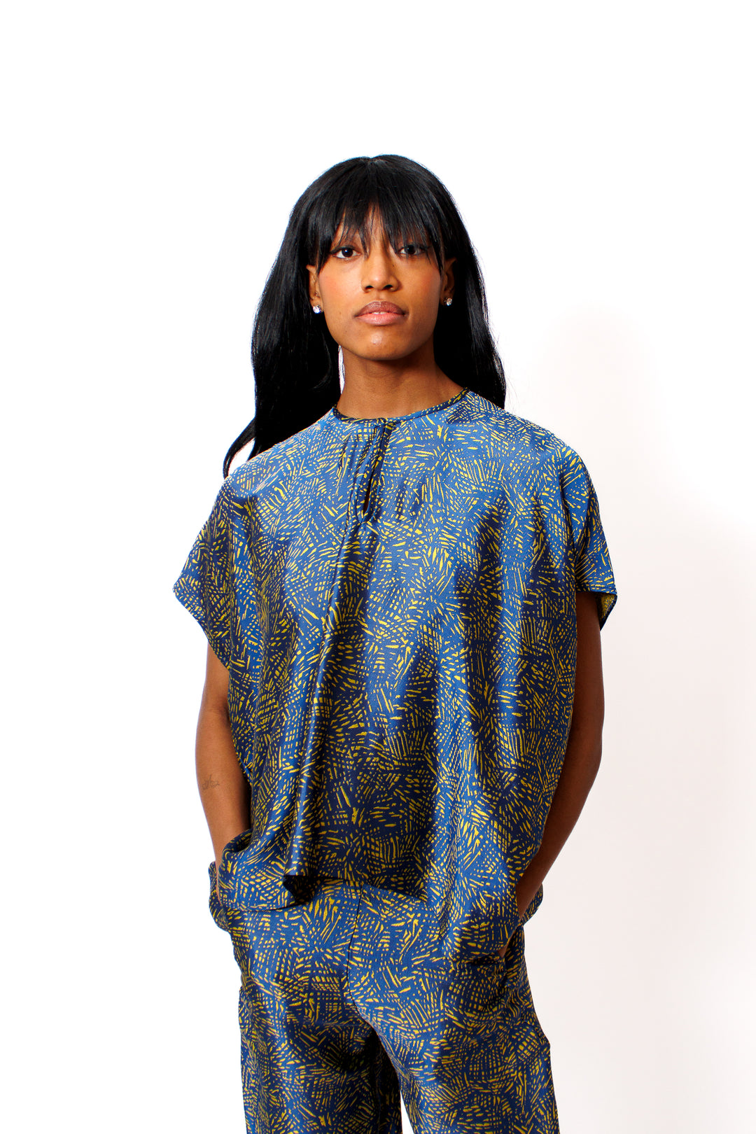 Ja'mes wearing  Zero + Maria Cornejo Rae Crosshatch Jacquard Poncho Top front view 