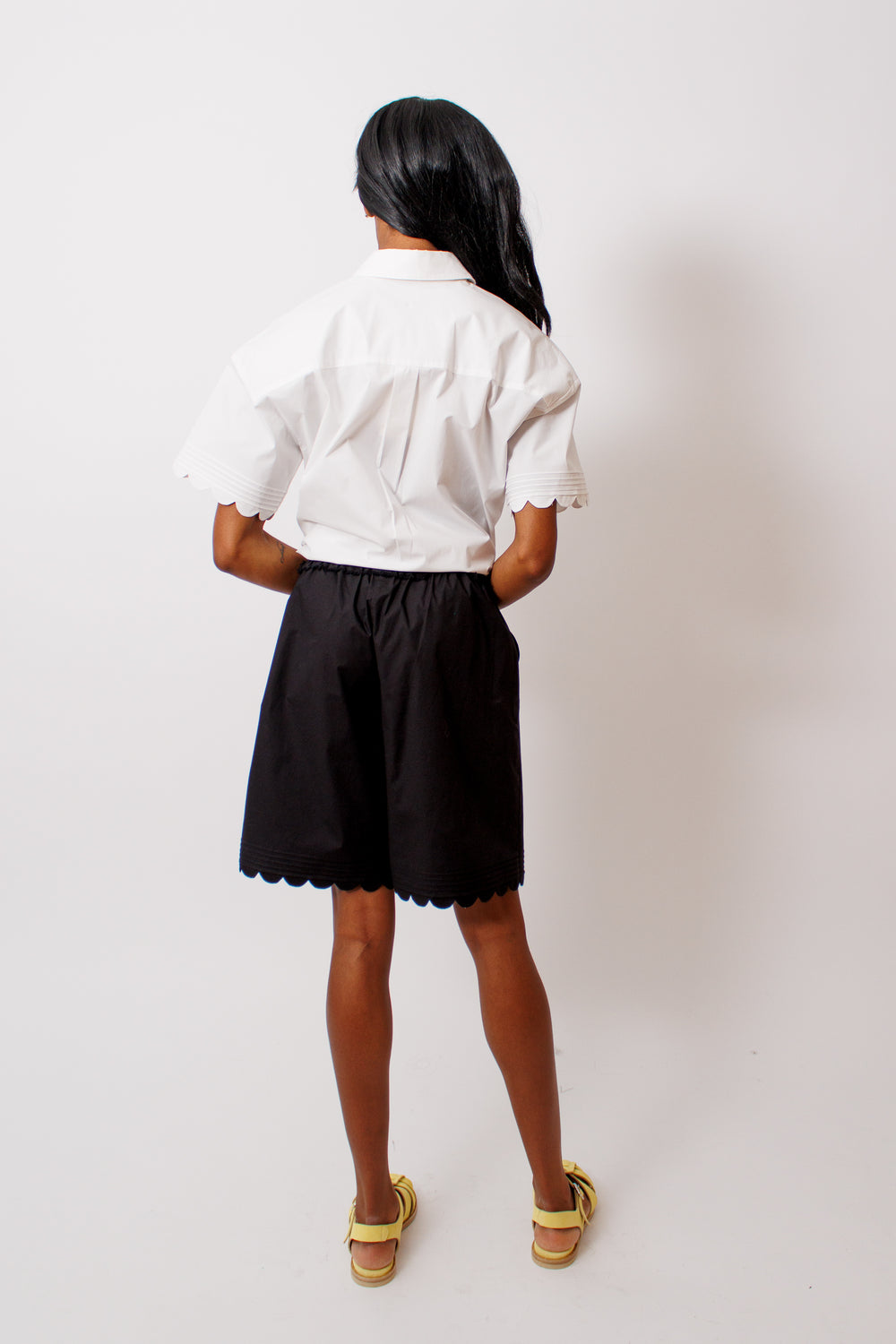 Ja'mes wearing The Garment Cyprus Shorts rear view