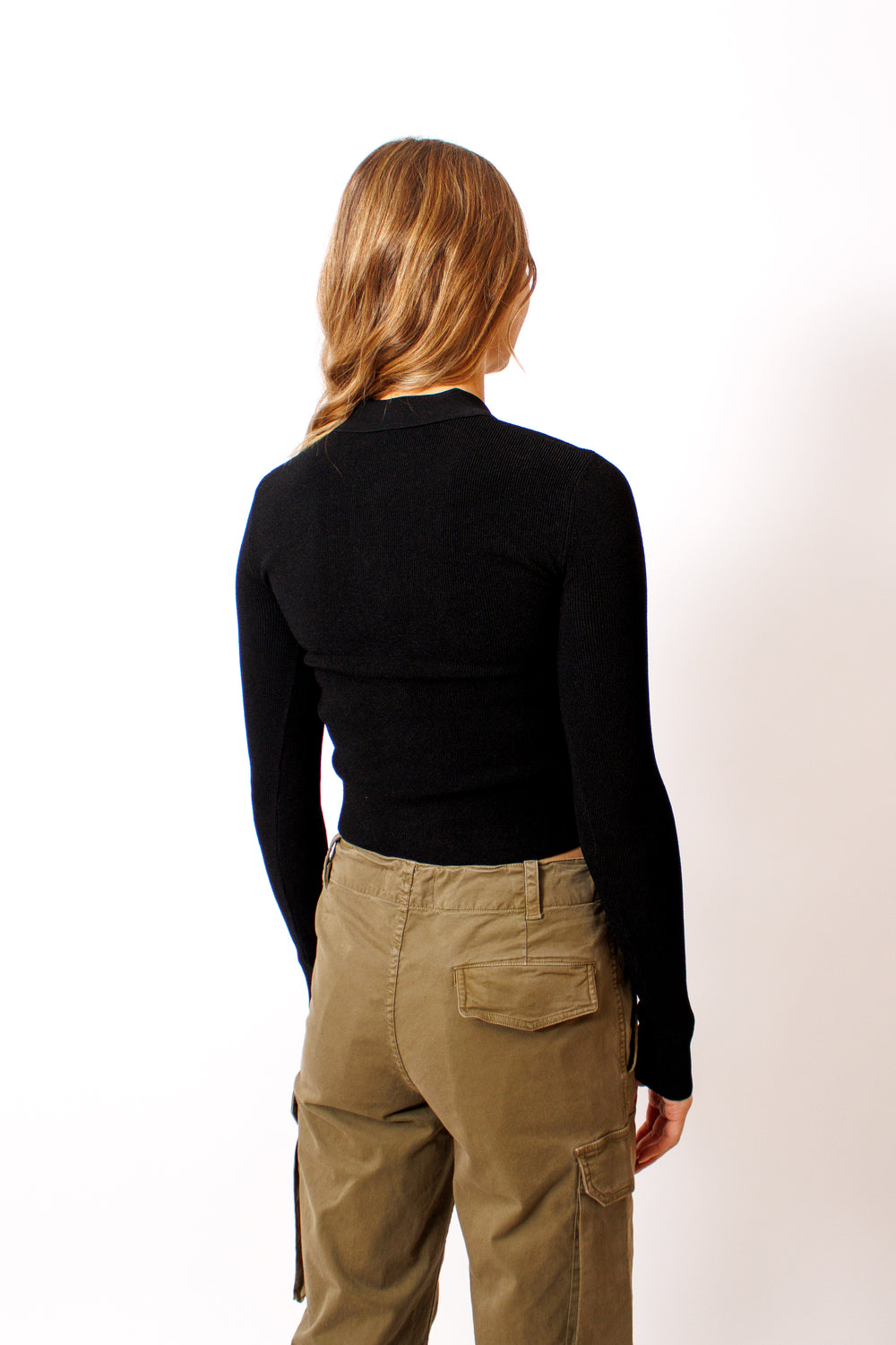 Mari wearing The Garment Madison Tight Polo Tee Sweater rear view