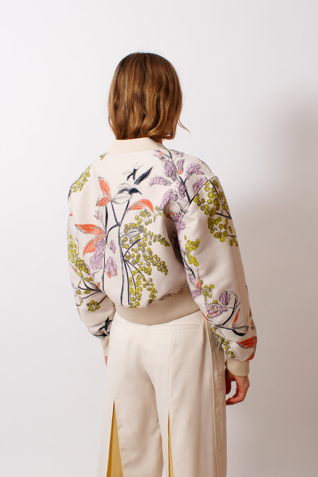 Mari wearing Stine Goya Woven Jacquard Cropped Drop Shoulder Bomber Jacket rear view 