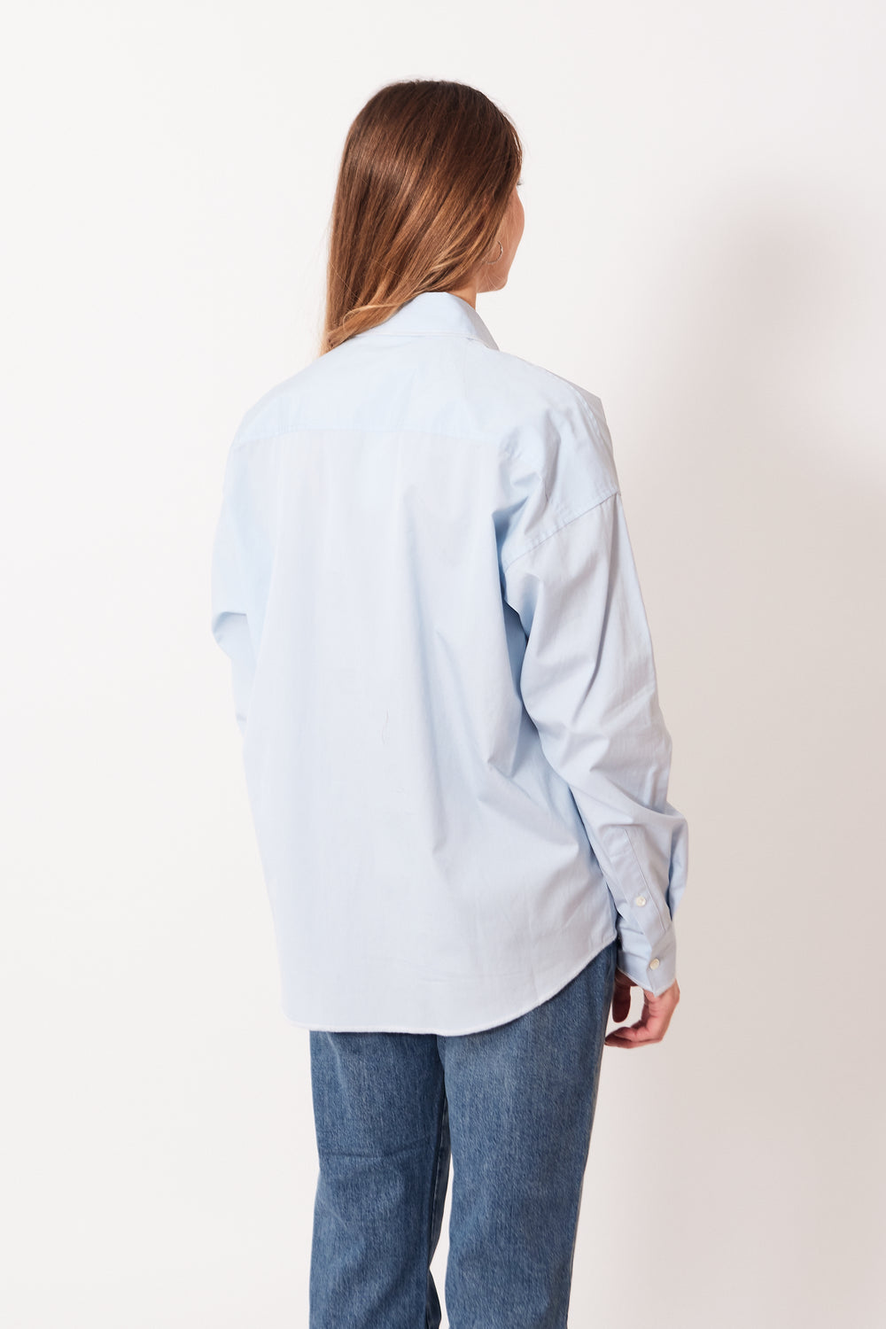 Mari wearing 6397 Contrast Overlock Uniform Shirt rear view