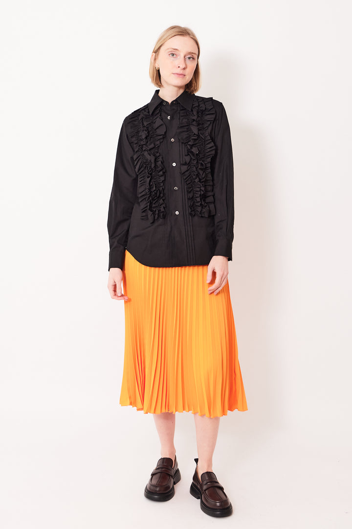 Madi wearing MM6 Maison Margiela Fluid Polyester Full Pleat Side Zip Skirt front view