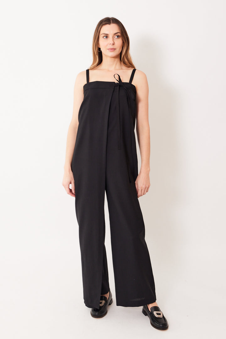 Mari wearing MM6 Maison Margiela Ultra High Waist Wrap Jumpsuit black front view