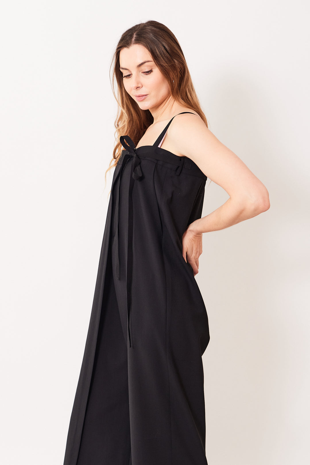 Mari wearing MM6 Maison Margiela Ultra High Waist Wrap Jumpsuit black side view