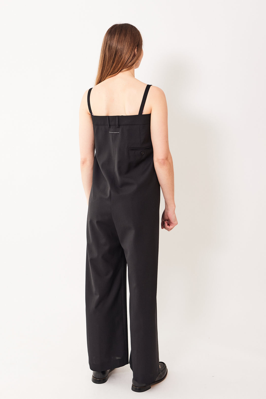 Mari wearing MM6 Maison Margiela Ultra High Waist Wrap Jumpsuit black rear view