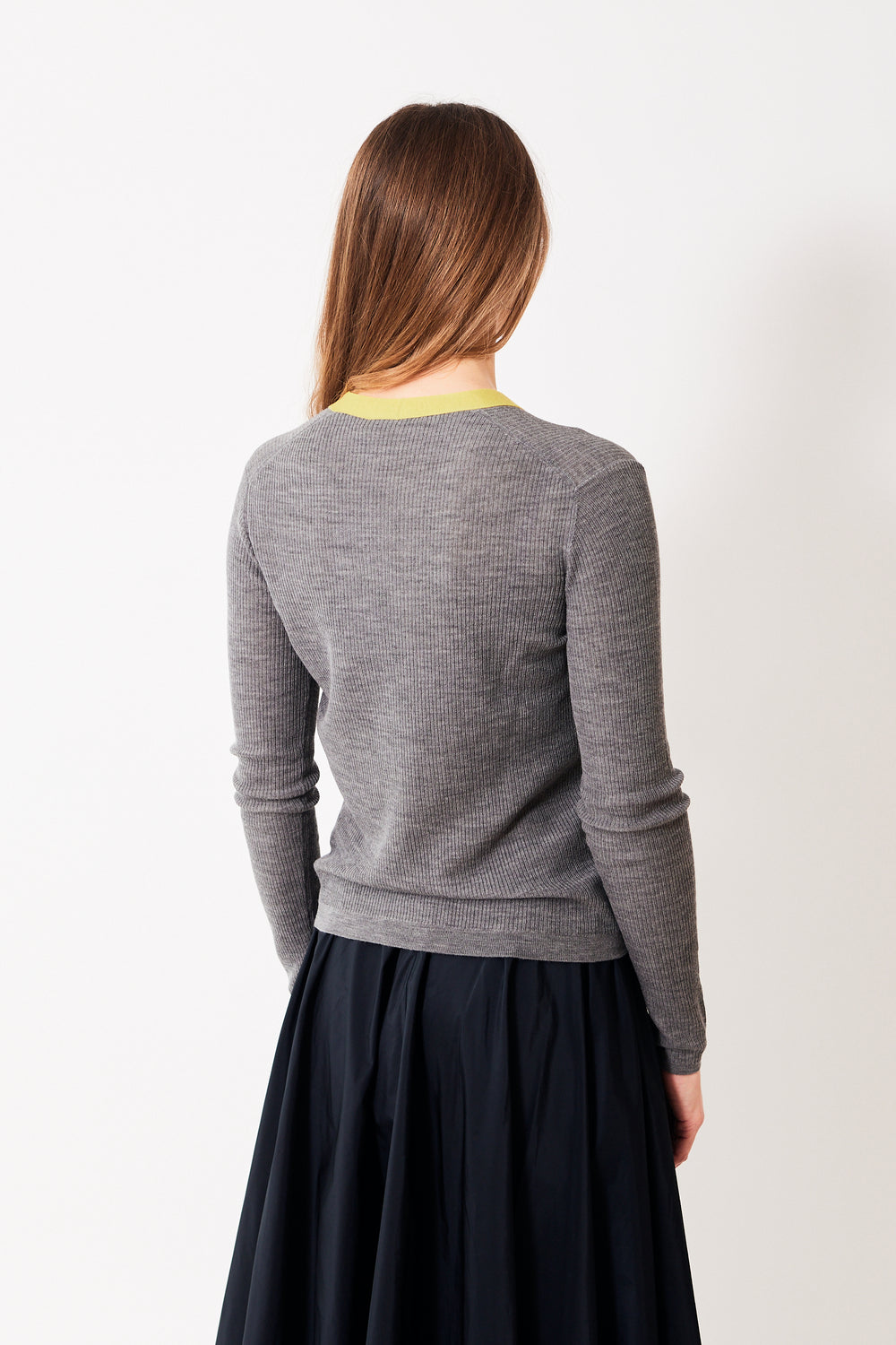 Mari wearing Odeeh Aureate Trimmed Virgin Wool Delicate Rib Cardigan rear view