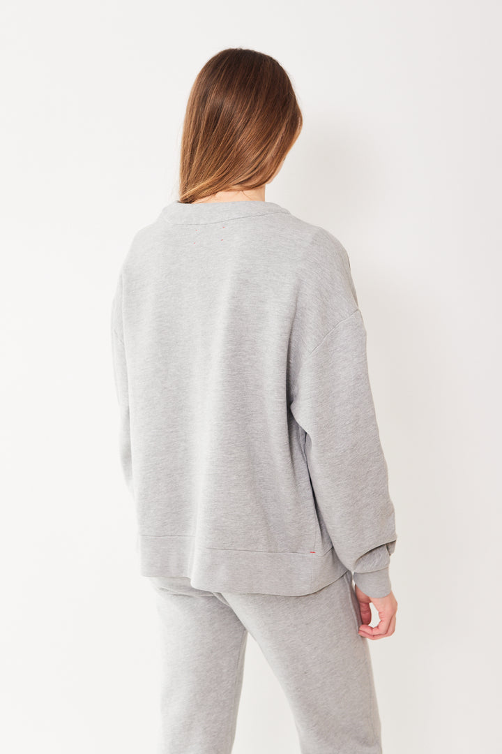 Mari wearing Xirena Benny Cardigan rear view