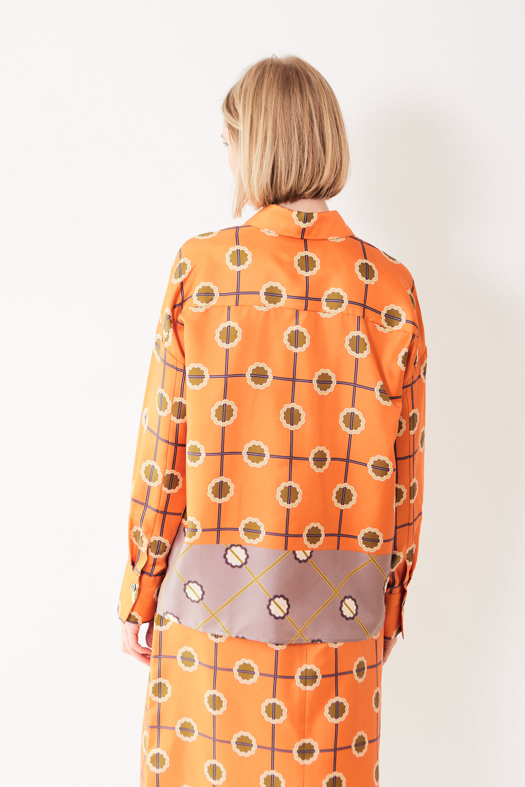 Madi wearing Odeeh Silk Abstract Trellis Motif Blouse rear view