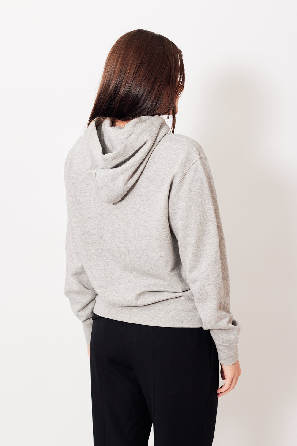 Julia wearing Comme des Garçons Full Zip Double Black Emblem Hooded Sweatshirt rear view