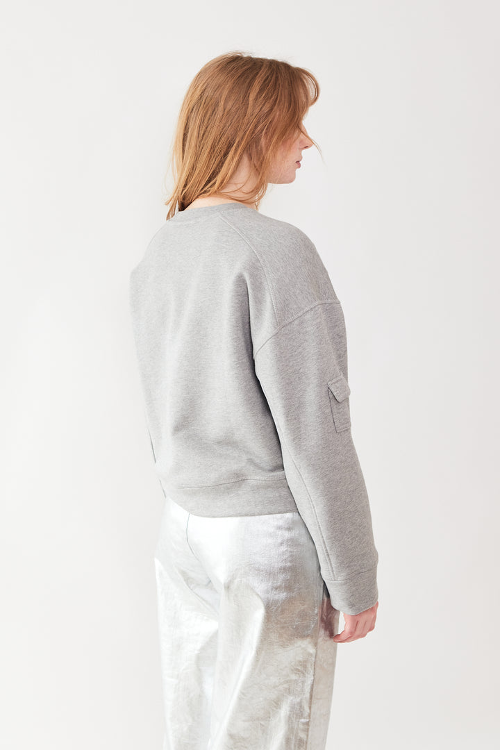 Waverly wearing Ganni Heavy Terry Drop Shoulder Sweat rear view