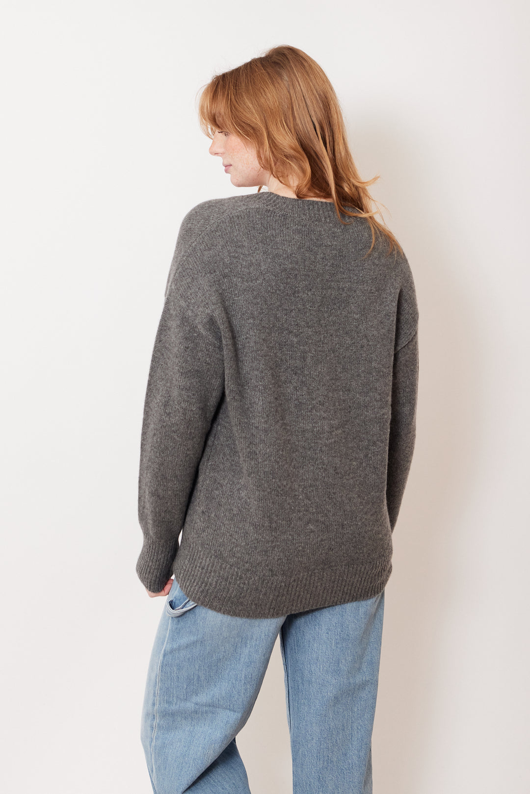 Waverly wearing White + Warren Cashmere Luxe Pocket Cardigan rear view