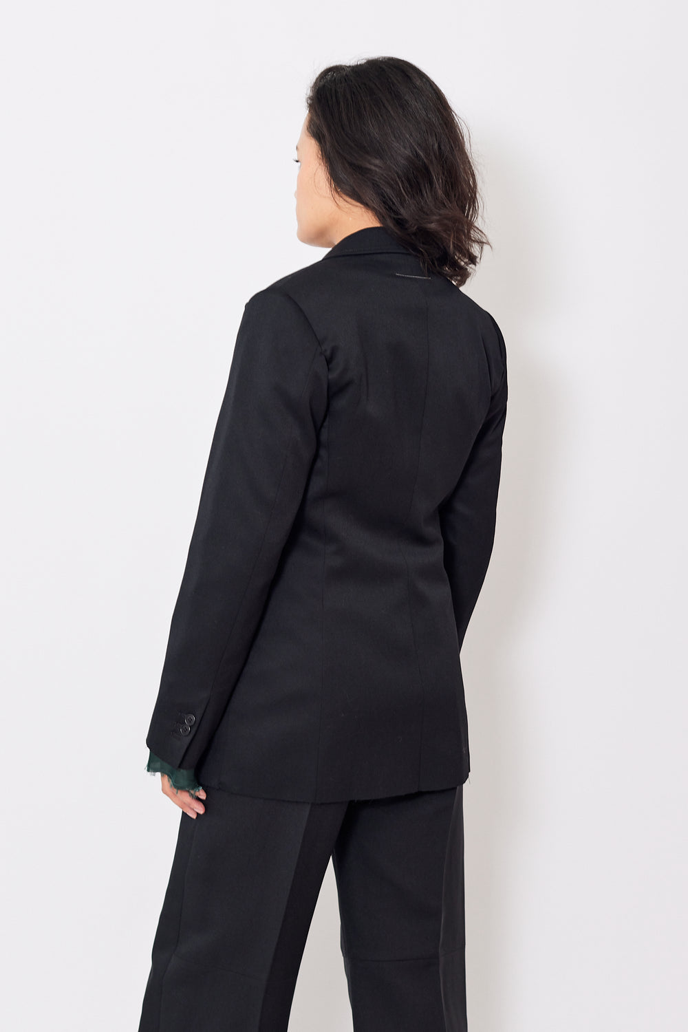 Amanda wearing MM6 Maison Margiela Slit Sleeve Blazer With Peek Through Lining rear view