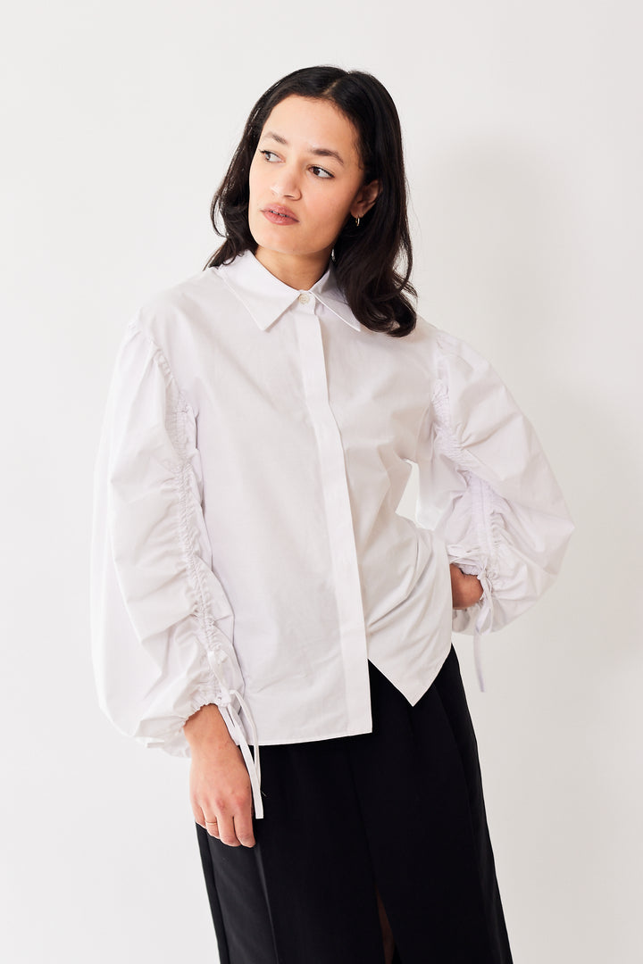 Amanda wearing Mantu Ruched Long Sleeve Button Down Shirt front view