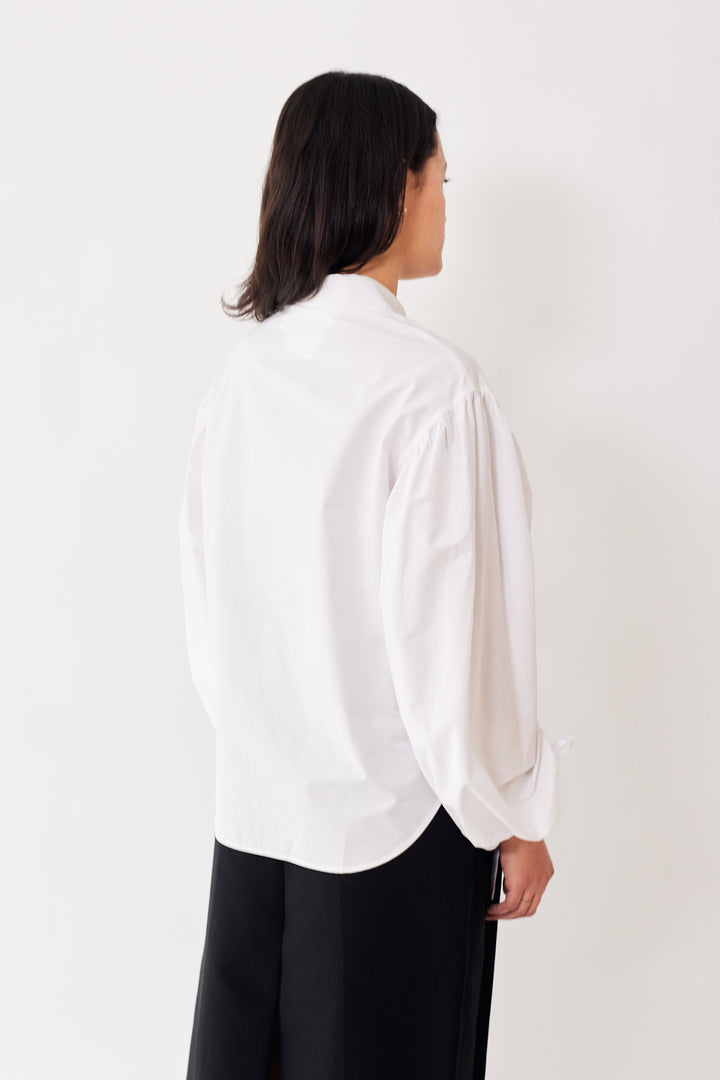 Amanda wearing Mantu Ruched Long Sleeve Button Down Shirt rear view