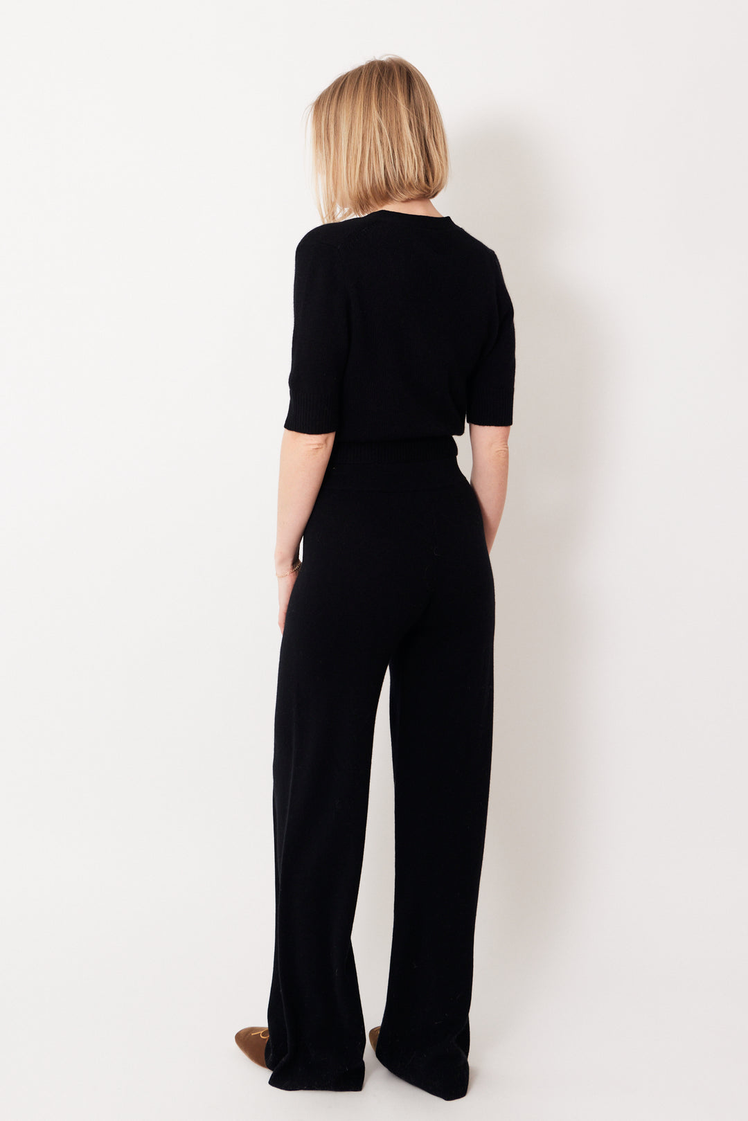 Madi wearing Allude Virgin Wool Cashmere Blend Comfy Trousers rear view