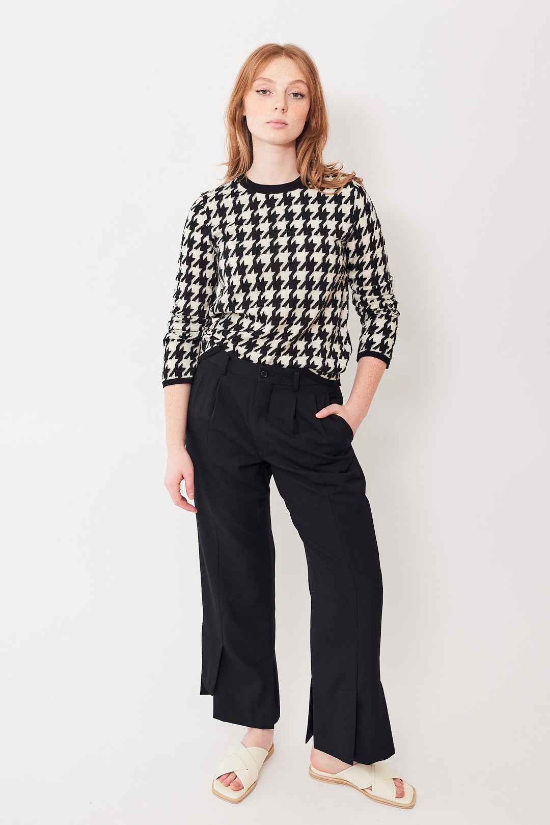 Waverly wearing Comme des Garçons Split Hi Lo Hem Pleated Trouser front view