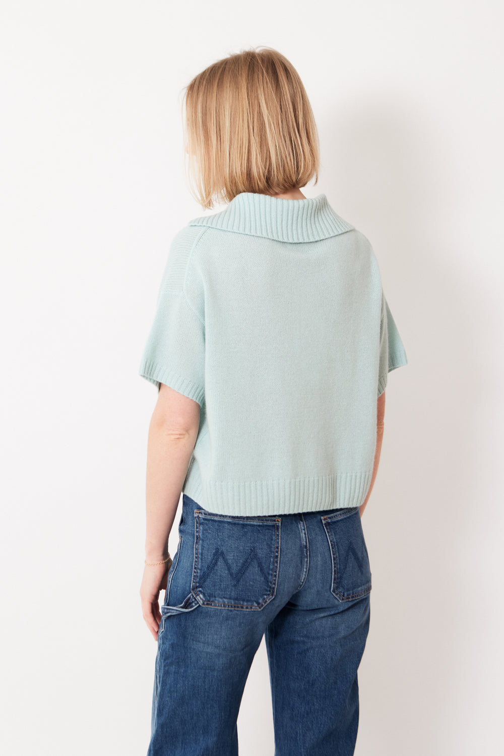 Madi wearing Allude Half Sleeve Half Zip Cashmere Polo Neck Sweater rear view