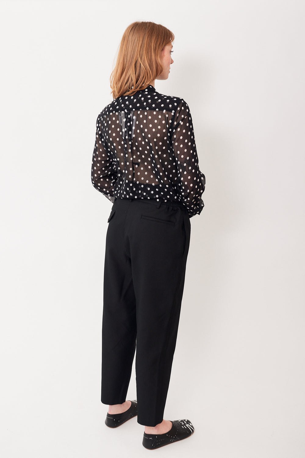 Waverly wearing Comme des Garçons Elasti Side Tapered Rib Trouser rear view